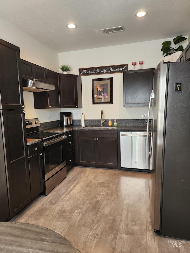 1018 S Washington Ave, Emmett, ID 83617 - kitchen featuring dark brown cabinetry, stainless steel appliances, and sink