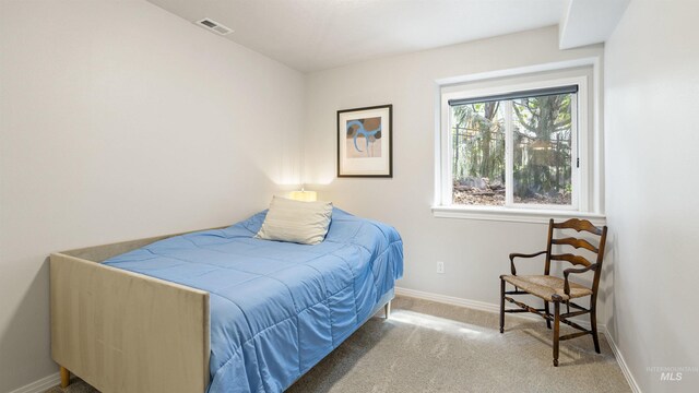 bedroom featuring carpet flooring and baseboards