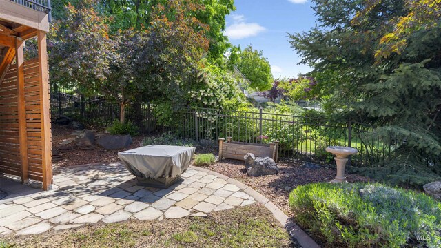 view of yard featuring fence and a patio area