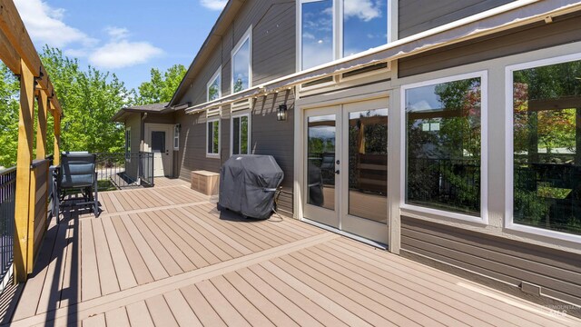 deck featuring a grill and french doors