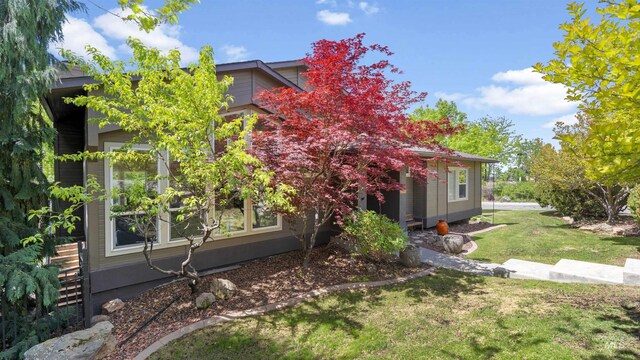 view of property exterior featuring a yard