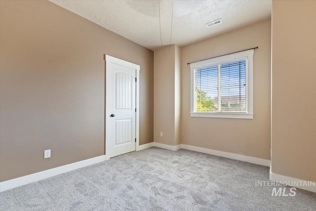 1112 W Belknap Dr, Nampa, ID 83686 - carpeted empty room featuring baseboards and a textured ceiling