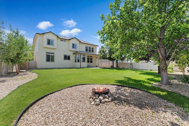 1112 W Belknap Dr, Nampa, ID 83686 - rear view of house featuring an outdoor fire pit and a fenced backyard