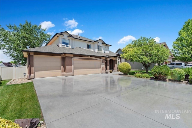 1112 W Belknap Dr, Nampa, ID 83686 - view of front of property featuring driveway, an attached garage, stucco siding, and roof with shingles