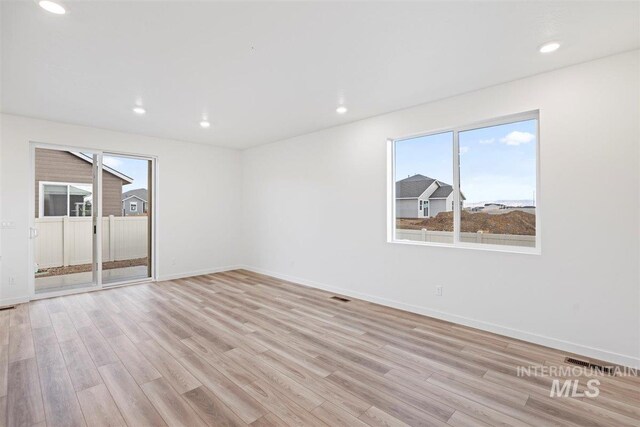 empty room with light wood-type flooring