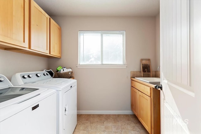 laundry room with cabinets and independent washer and dryer