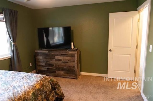 bedroom featuring light carpet