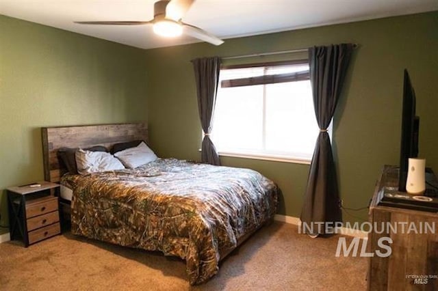 carpeted bedroom with ceiling fan