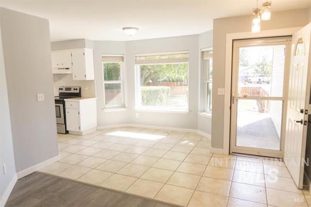 doorway to outside featuring plenty of natural light and light tile patterned floors