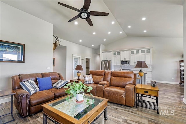 3492 E 3600 N, Kimberly, ID 83341 - living room with a ceiling fan, light wood-style flooring, baseboards, high vaulted ceiling, and recessed lighting