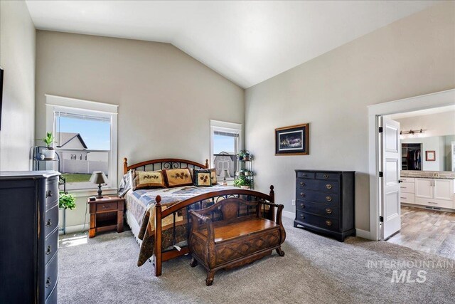 3492 E 3600 N, Kimberly, ID 83341 - bedroom with lofted ceiling, light colored carpet, ensuite bathroom, and baseboards