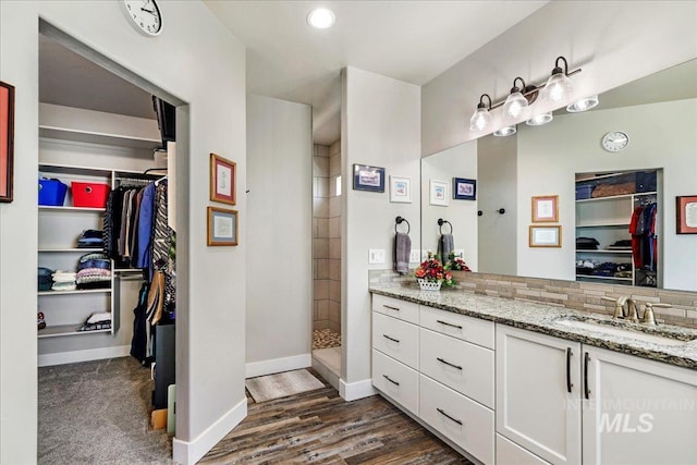 3492 E 3600 N, Kimberly, ID 83341 - full bathroom with vanity, a spacious closet, a walk in shower, baseboards, and wood finished floors