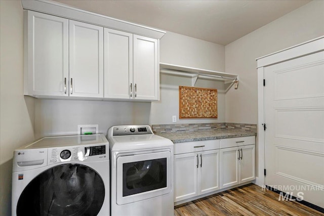 3492 E 3600 N, Kimberly, ID 83341 - washroom featuring independent washer and dryer, cabinet space, and wood finished floors