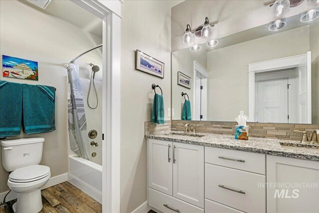 3492 E 3600 N, Kimberly, ID 83341 - bathroom featuring decorative backsplash, double vanity, toilet, and shower / bath combination with curtain