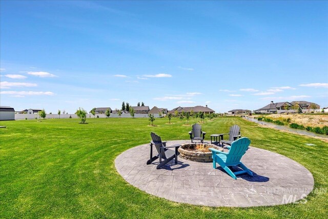3492 E 3600 N, Kimberly, ID 83341 - view of grassy yard with a fire pit, a patio, and a residential view