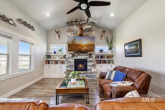 3492 E 3600 N, Kimberly, ID 83341 - living room featuring ceiling fan, wood finished floors, a fireplace, vaulted ceiling, and baseboards