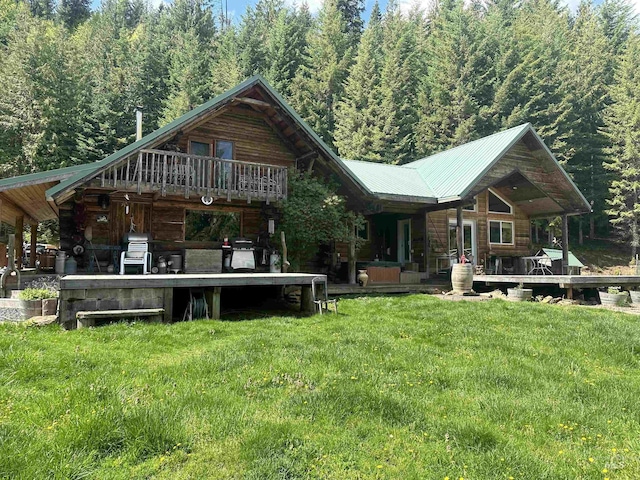 2223 Glenwood Rd, Kamiah, ID 83536 - back of property featuring a yard, a forest view, and metal roof
