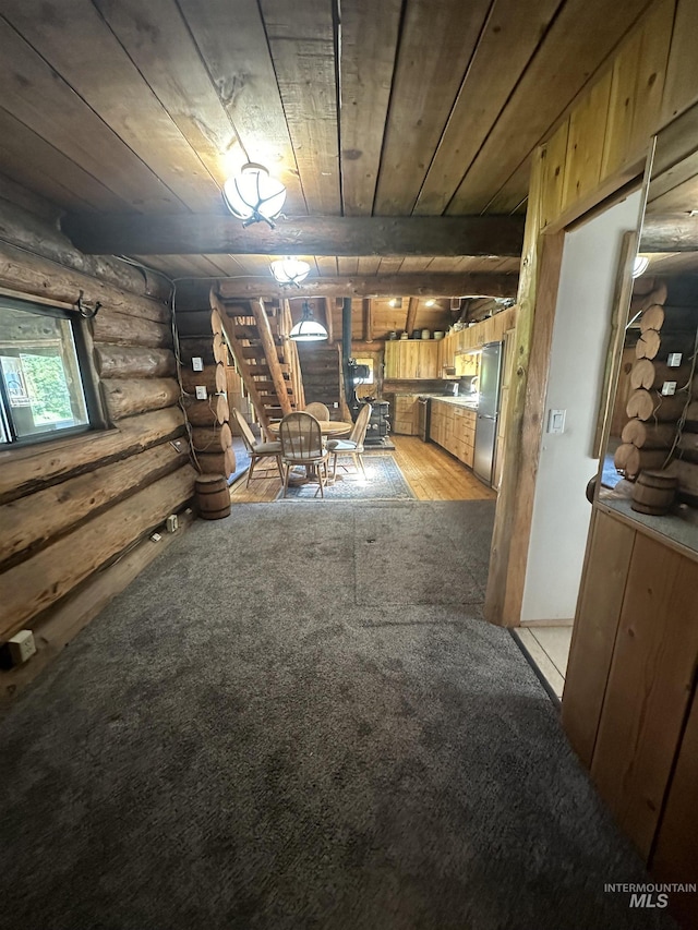 2223 Glenwood Rd, Kamiah, ID 83536 - below grade area with stairs, wooden ceiling, light colored carpet, and freestanding refrigerator