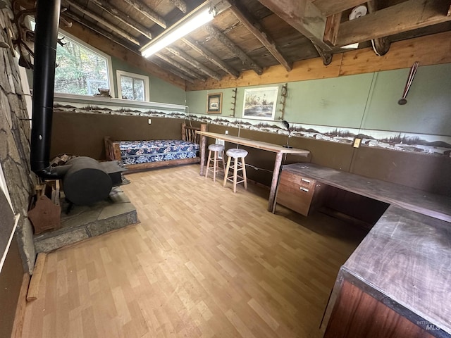 2223 Glenwood Rd, Kamiah, ID 83536 - below grade area featuring a wood stove, wood ceiling, and wood finished floors
