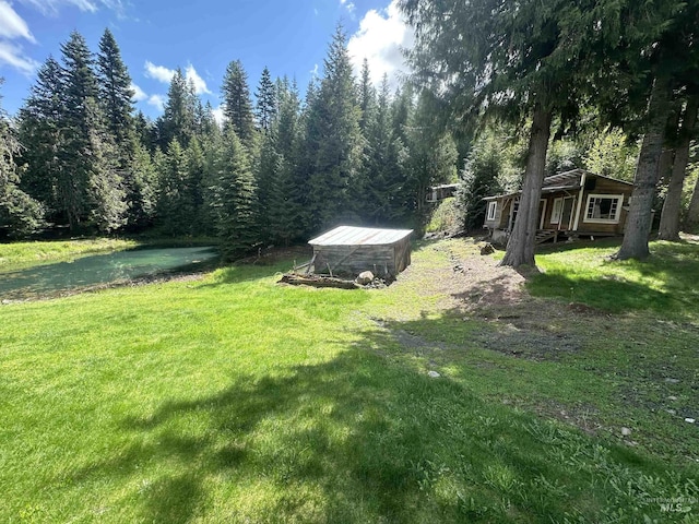 2223 Glenwood Rd, Kamiah, ID 83536 - view of yard with a wooded view and an outbuilding