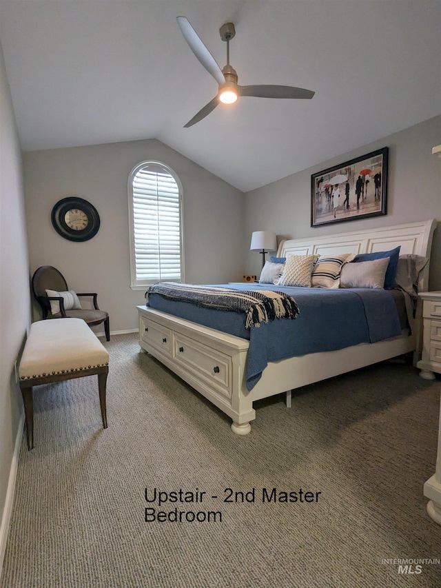 carpeted bedroom with ceiling fan and lofted ceiling