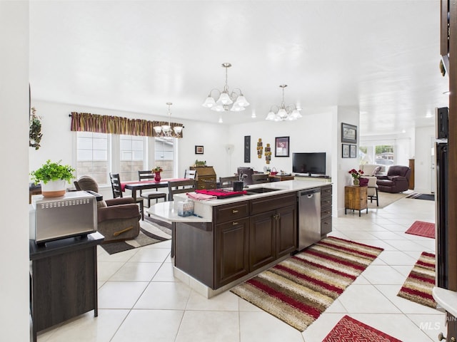 11 N 3rd W, St, Paul, ID 83347 - kitchen with stainless steel dishwasher, open floor plan, a chandelier, light countertops, and light tile patterned flooring