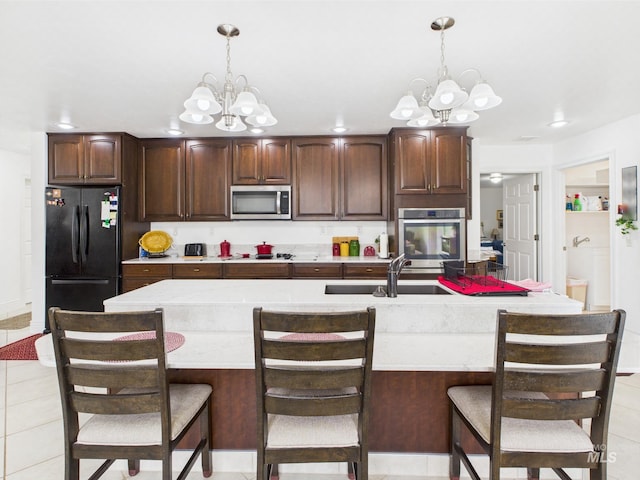 11 N 3rd W, St, Paul, ID 83347 - kitchen featuring appliances with stainless steel finishes, a chandelier, a sink, and light countertops