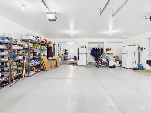 11 N 3rd W, St, Paul, ID 83347 - garage with freestanding refrigerator and a garage door opener