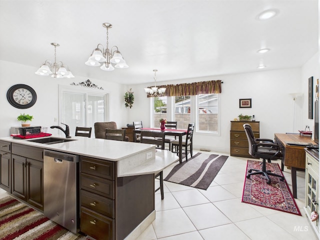 11 N 3rd W, St, Paul, ID 83347 - kitchen featuring stainless steel dishwasher, a chandelier, light countertops, a kitchen breakfast bar, and a sink