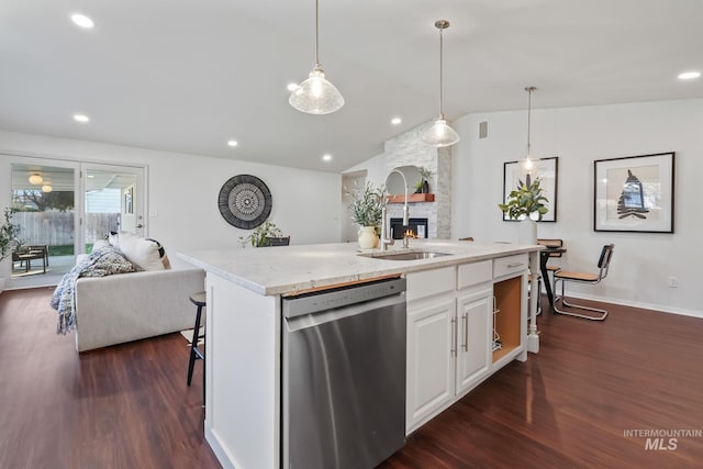 kitchen featuring stainless steel dishwasher, dark hardwood / wood-style floors, white cabinetry, and lofted ceiling