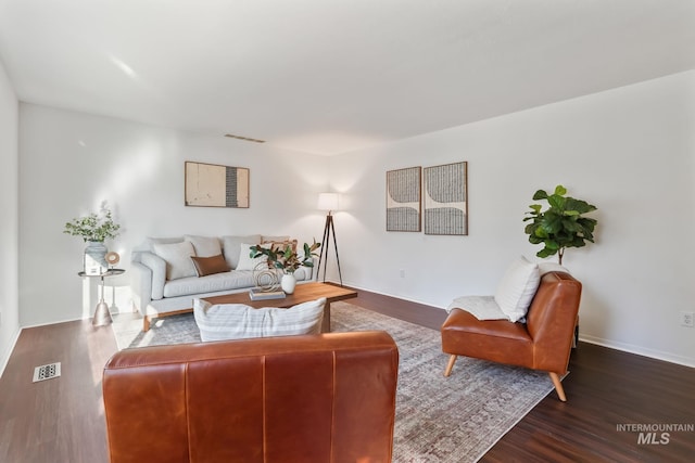 living room with dark hardwood / wood-style floors