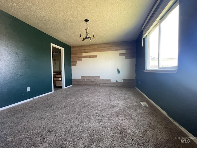 3915 N Abbott St, Caldwell, ID 83607 - unfurnished room featuring a chandelier, carpet, a textured ceiling, and baseboards