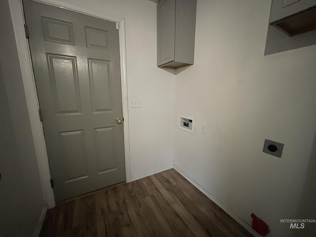 3915 N Abbott St, Caldwell, ID 83607 - washroom featuring cabinet space, hookup for an electric dryer, dark wood-style flooring, hookup for a washing machine, and baseboards