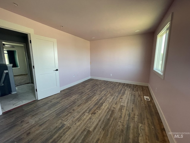 3915 N Abbott St, Caldwell, ID 83607 - unfurnished room with dark wood-type flooring and baseboards
