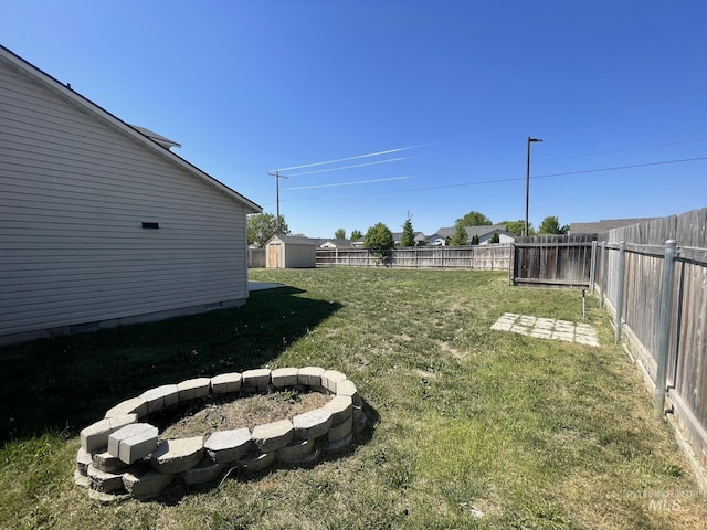 3915 N Abbott St, Caldwell, ID 83607 - view of yard with an outdoor fire pit, a storage shed, and an outdoor structure
