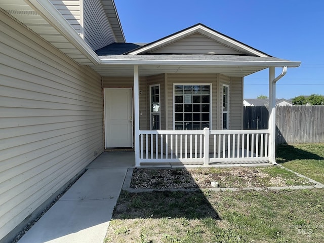 3915 N Abbott St, Caldwell, ID 83607 - view of exterior entry with a porch and fence