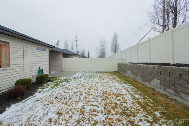 view of yard layered in snow