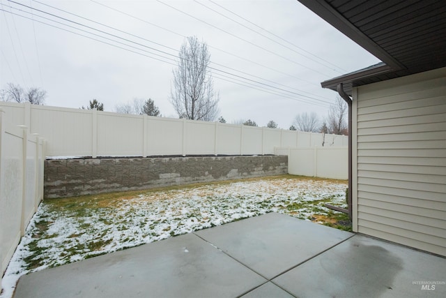 view of snow covered patio