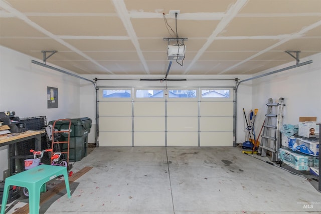 garage featuring electric panel and a garage door opener