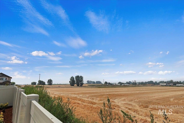 view of yard with a rural view