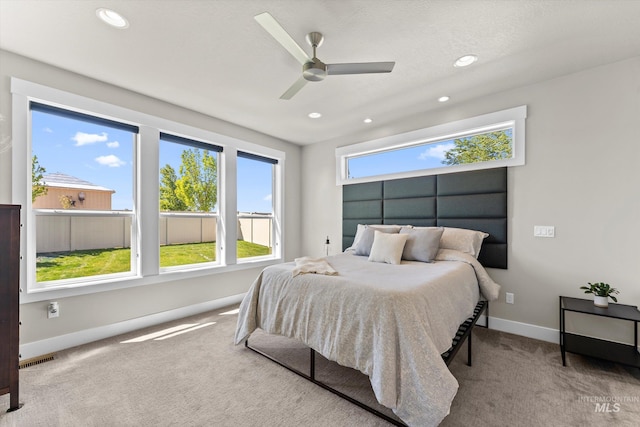 carpeted bedroom with recessed lighting, baseboards, and a ceiling fan