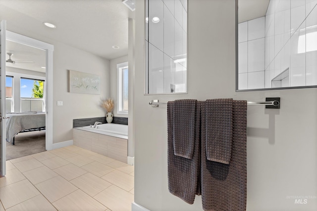 bathroom featuring a garden tub, baseboards, ceiling fan, tile patterned flooring, and recessed lighting
