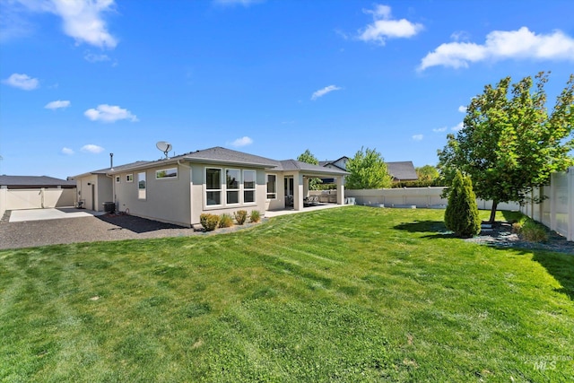 rear view of house featuring a patio, central AC unit, and stucco siding