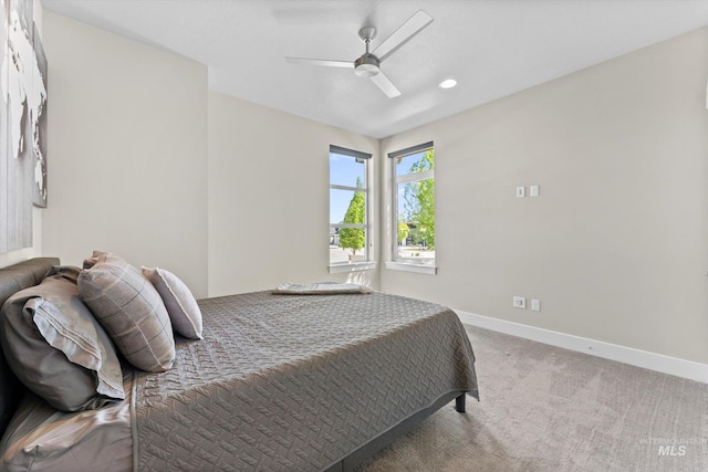 carpeted bedroom featuring baseboards, a ceiling fan, and recessed lighting