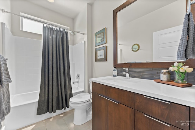 bathroom featuring shower / tub combo with curtain, tile patterned floors, decorative backsplash, toilet, and vanity