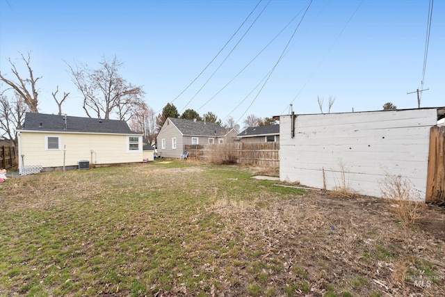 view of yard with cooling unit and fence