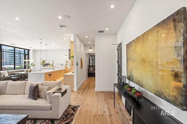 1112 W Main St Unit 503, Boise, ID 83702 - living area with light wood-style floors and recessed lighting