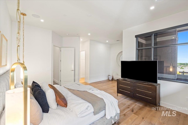 1112 W Main St Unit 503, Boise, ID 83702 - bedroom featuring light wood-style flooring and recessed lighting
