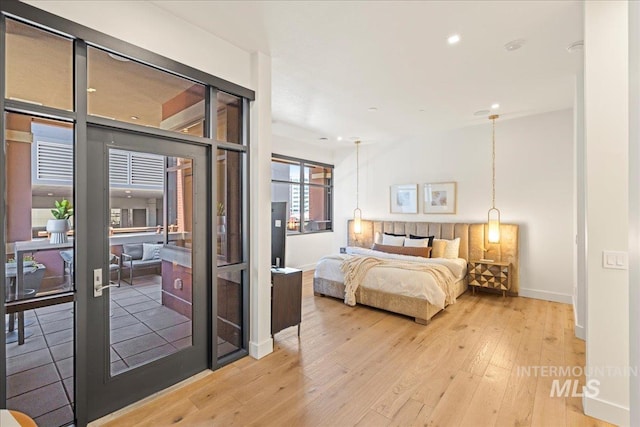 1112 W Main St Unit 503, Boise, ID 83702 - bedroom featuring light wood-style flooring, recessed lighting, and access to outside