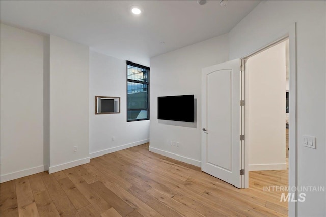 1112 W Main St Unit 503, Boise, ID 83702 - unfurnished living room with light wood-style floors and recessed lighting